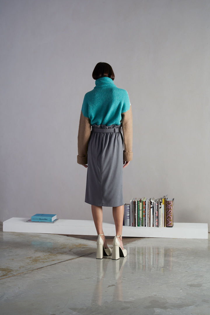 Cream, turquoise and tan wool jumper.