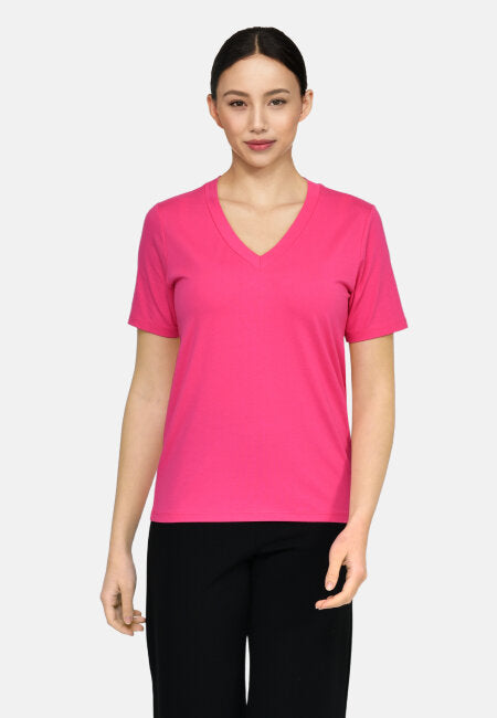 Pink V-neck t-shirt.